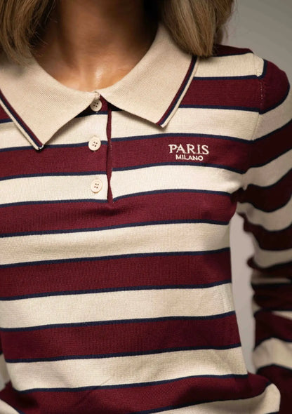 Close-up of a Byxie striped polo shirt with 'PARIS MILANO' branding.